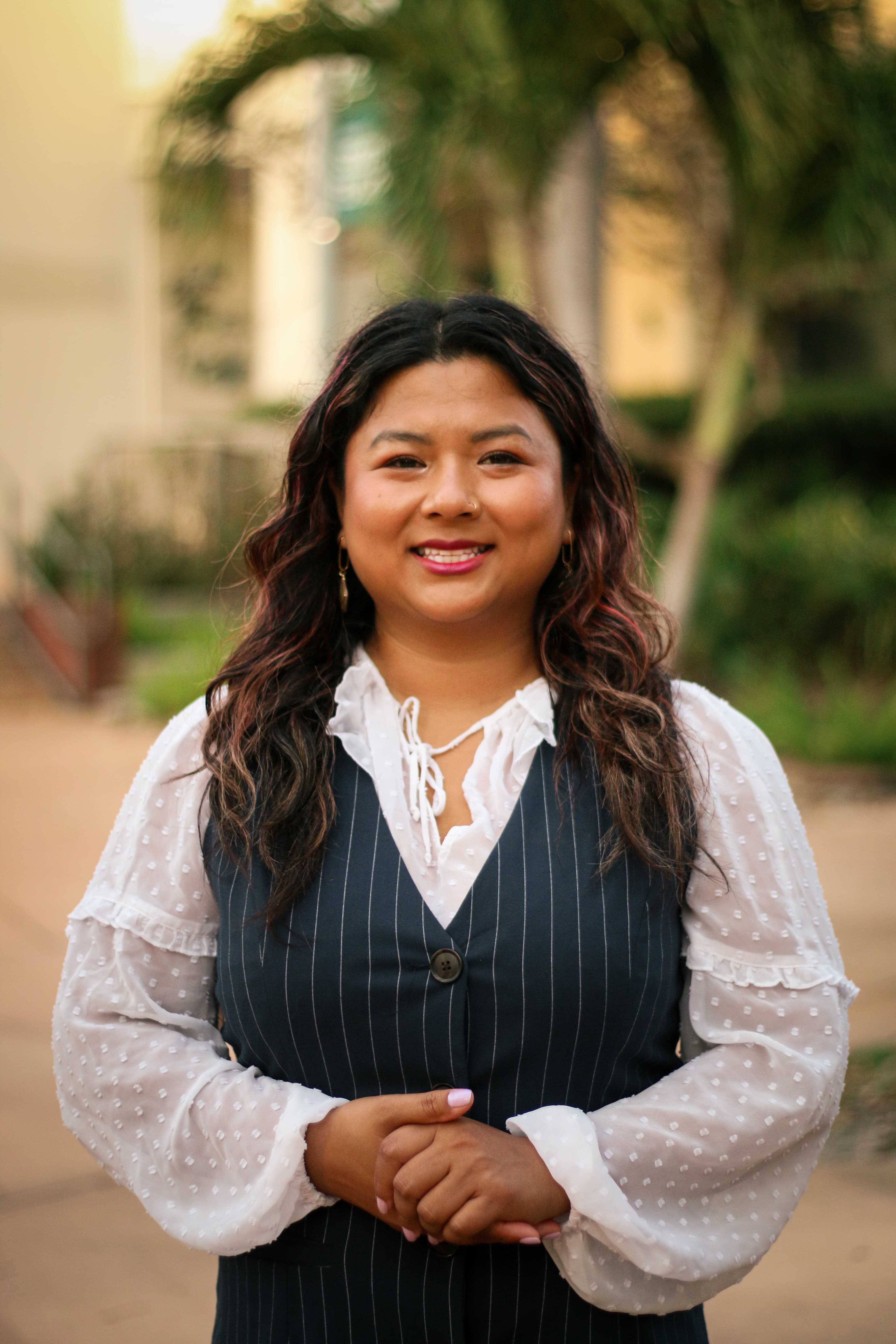 May Thach smiling at camera