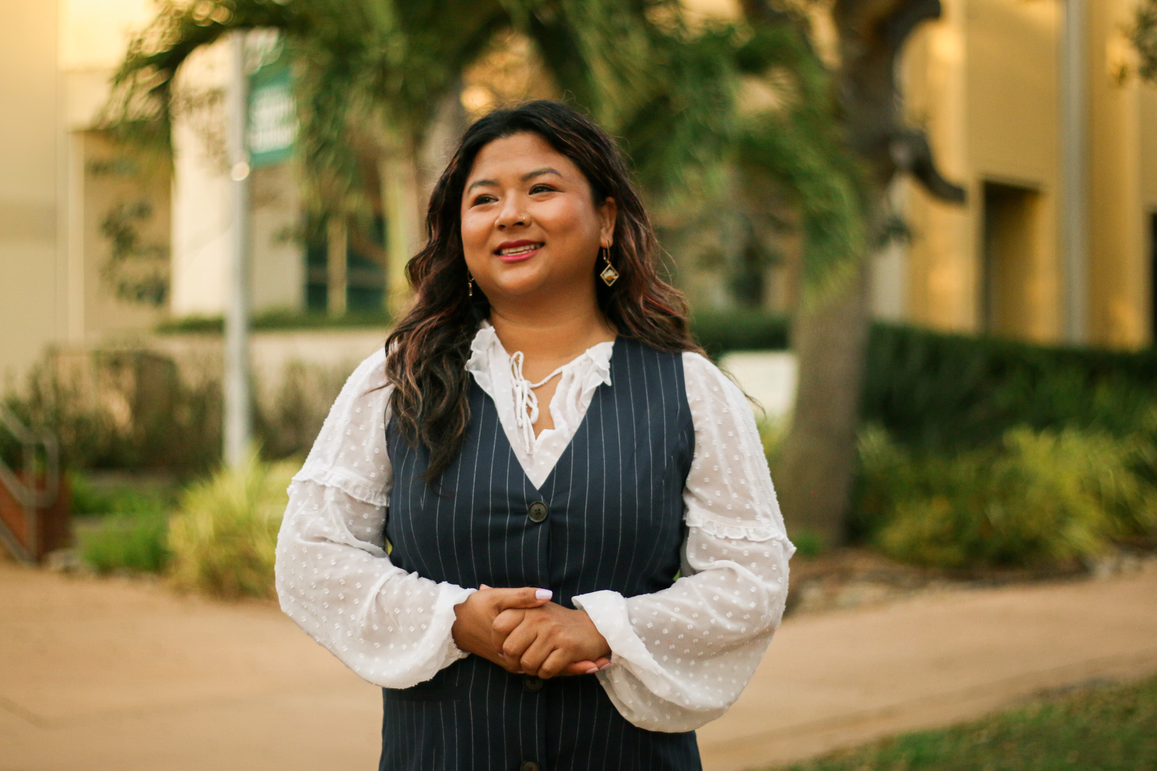 May Thach smiling away from camera